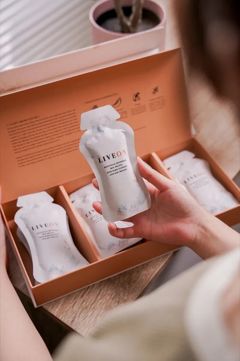 LiveOn sachets in the open box, one held in hand